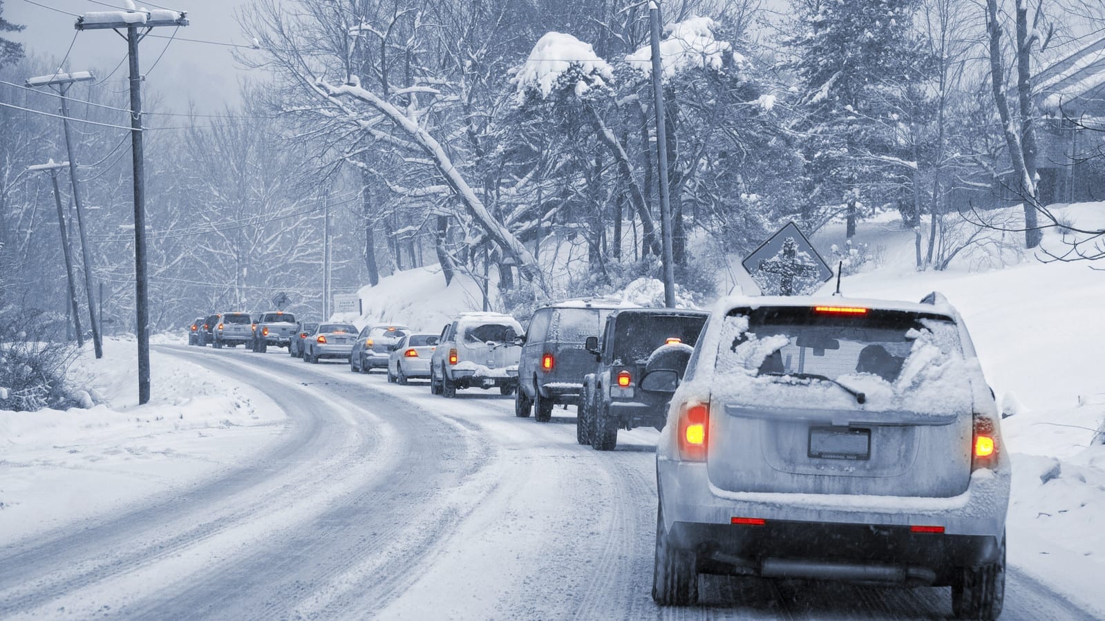 Stock photo of a line of traffic on a snowy road