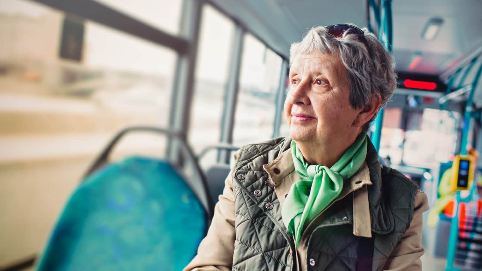 Elderly Woman Riding A City Bus Stock Photo