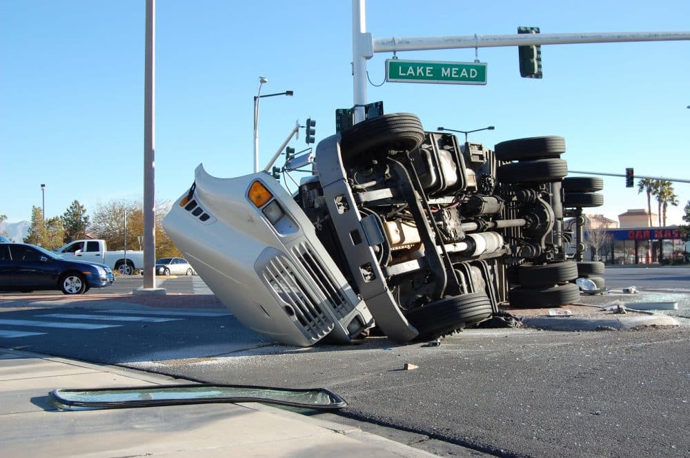 The scene of a truck accident at an intersection.