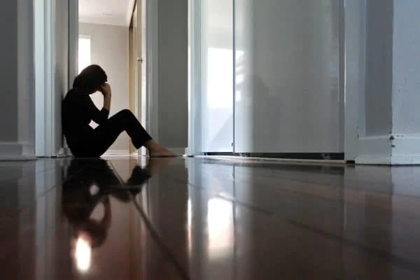 A woman feeling depressed after a car accident.